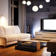 Сочетание в гостиной белого и теплого света благодаря зонированию подсветки на основную и локальную